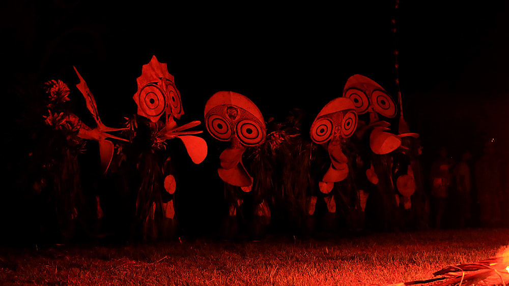 Baining tribesmen prepare for the fire dance, East New Britain